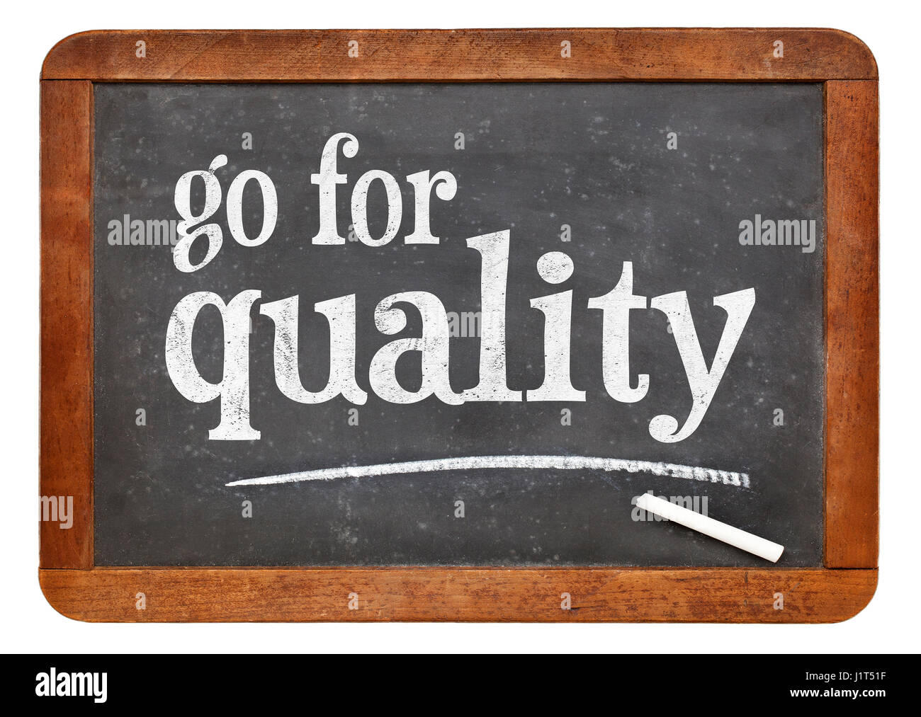 go for quality sign - white chalk text on a vintage slate blackboard Stock Photo