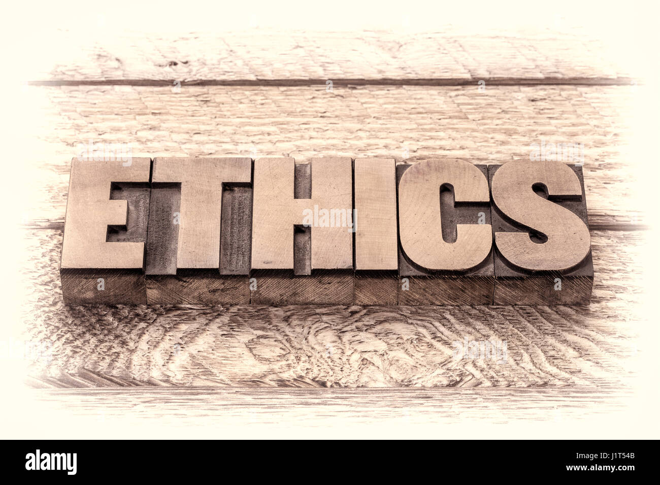 ethics word in vintage letterpress wood type, retro sepia toning Stock Photo
