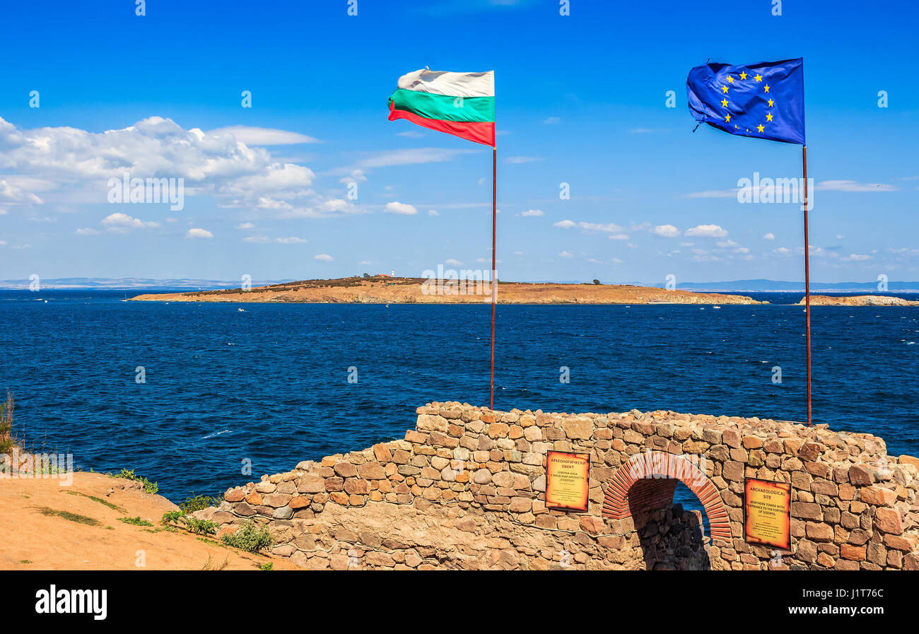 SOZOPOL, BULGARIA - SEPTEMBER 08, 2013: Northen tower with entrance to the fortress of sozopol. European and Bulgarian flag wave abow the Black Sea sh Stock Photo