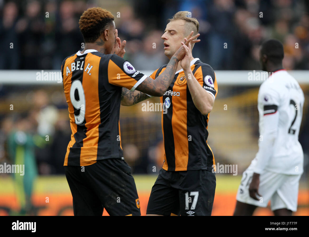 Hull City's Abel Hernandez (left) and Kamil Grosicki (right) celebrate after the final whistle during the Premier League match at the KCOM Stadium, Hull. Stock Photo