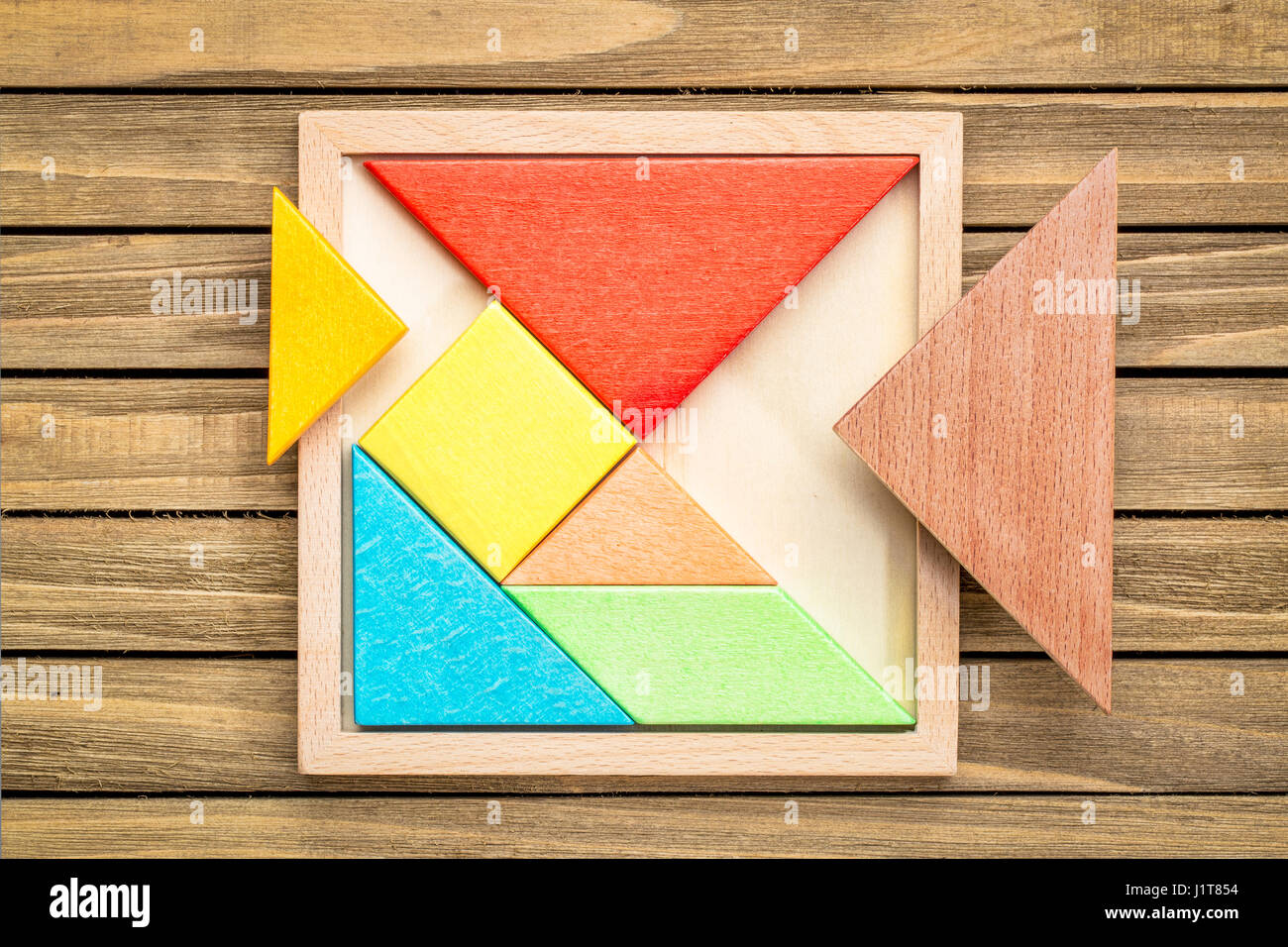 Tangram, a traditional Chinese Game made of different wood parts build abstract figures Stock Photo - Alamy