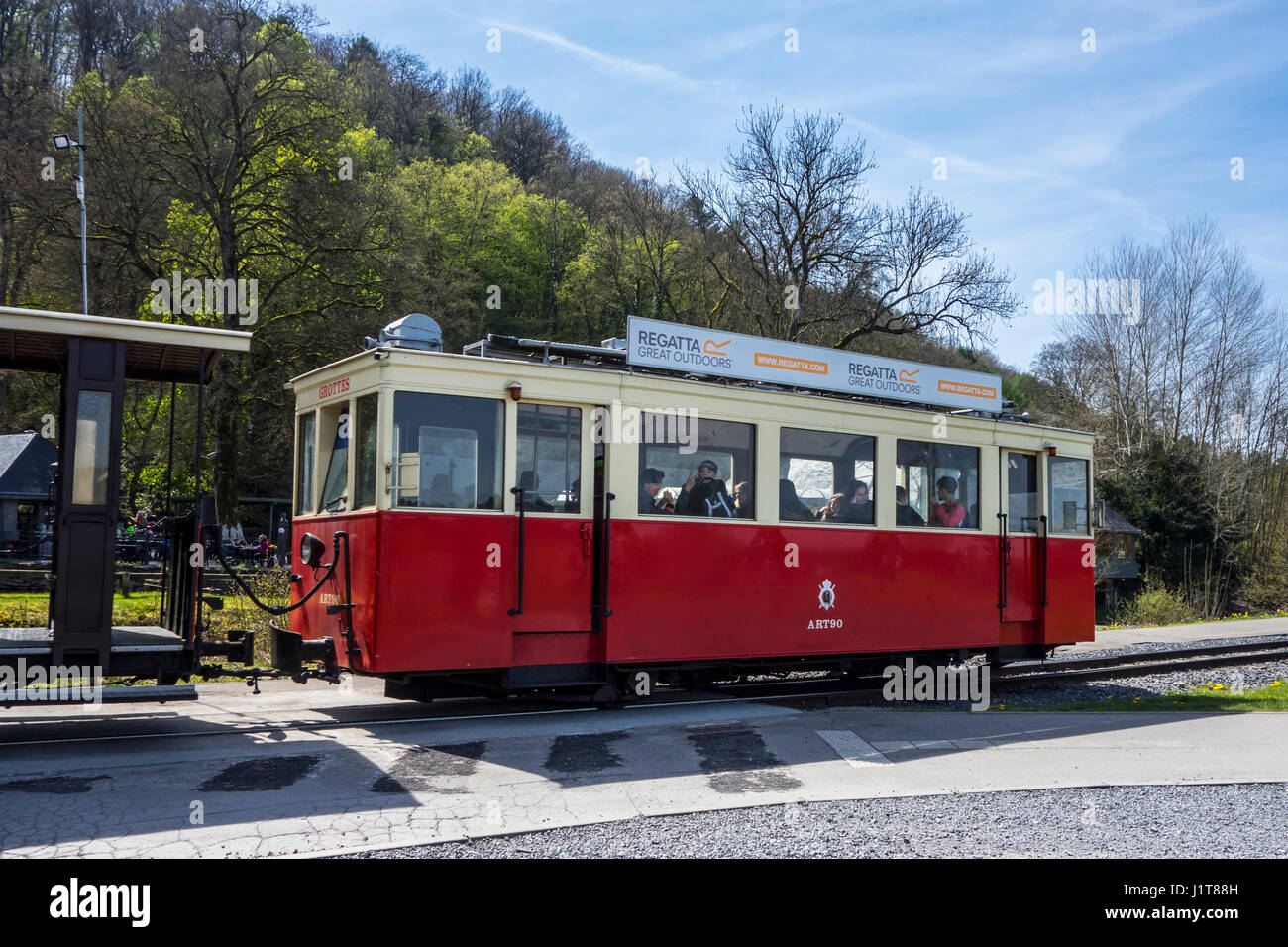 Red vintage streetcar at the estate of the Caves of Han-sur-Lesse / Grottes de Han, Belgian Ardennes, Belgium Stock Photo