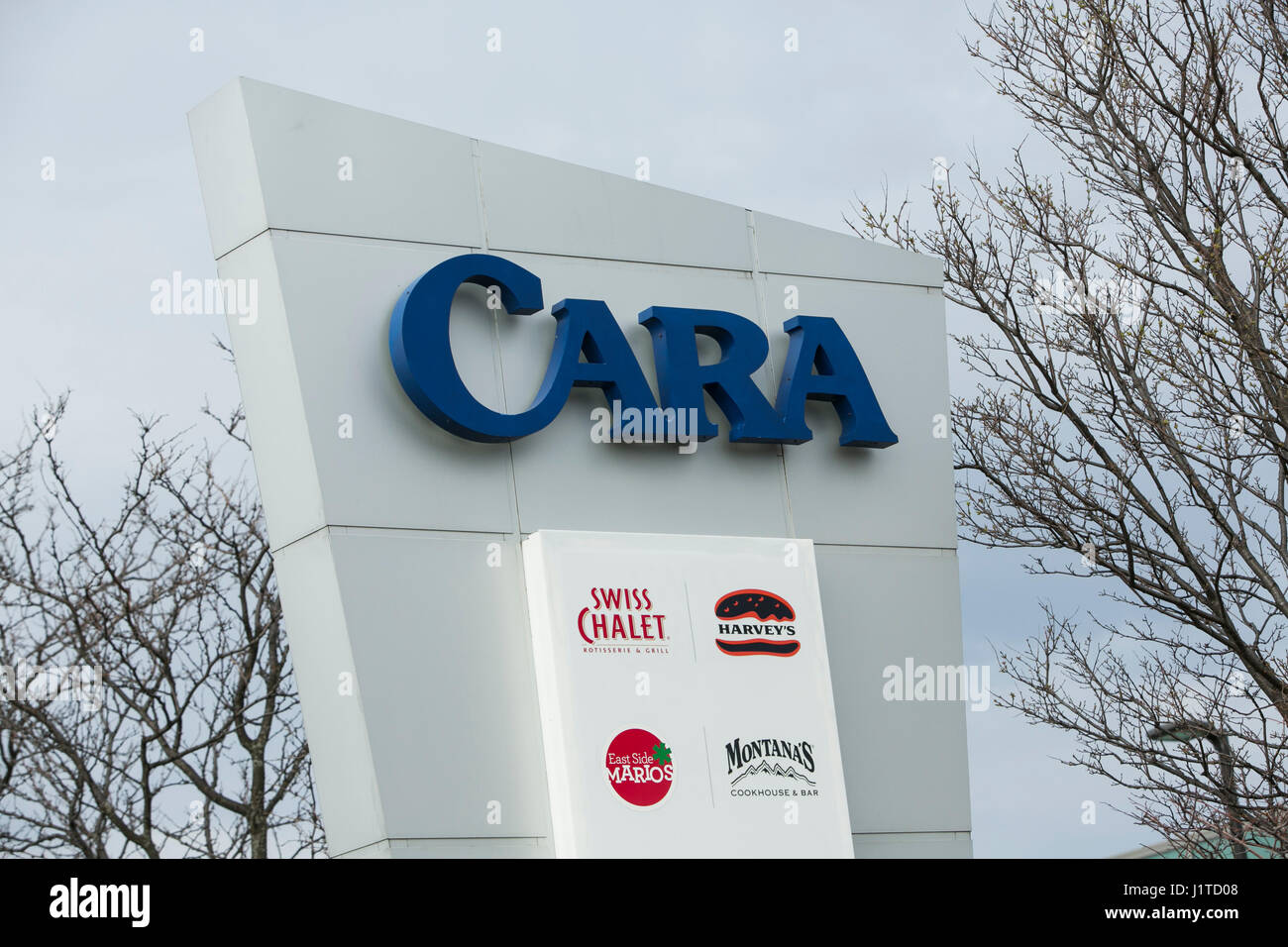 A logo sign outside of the headquarters of Cara Operations Ltd., in Vaughan, Ontario, Canada, on April 16, 2017. Stock Photo