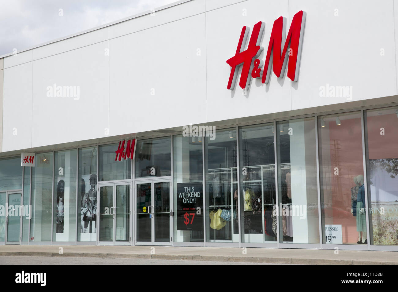 A logo sign outside of a Hennes Mauritz H M retail store in Mississauga Ontario Canada on April 16 2017 Stock Photo Alamy