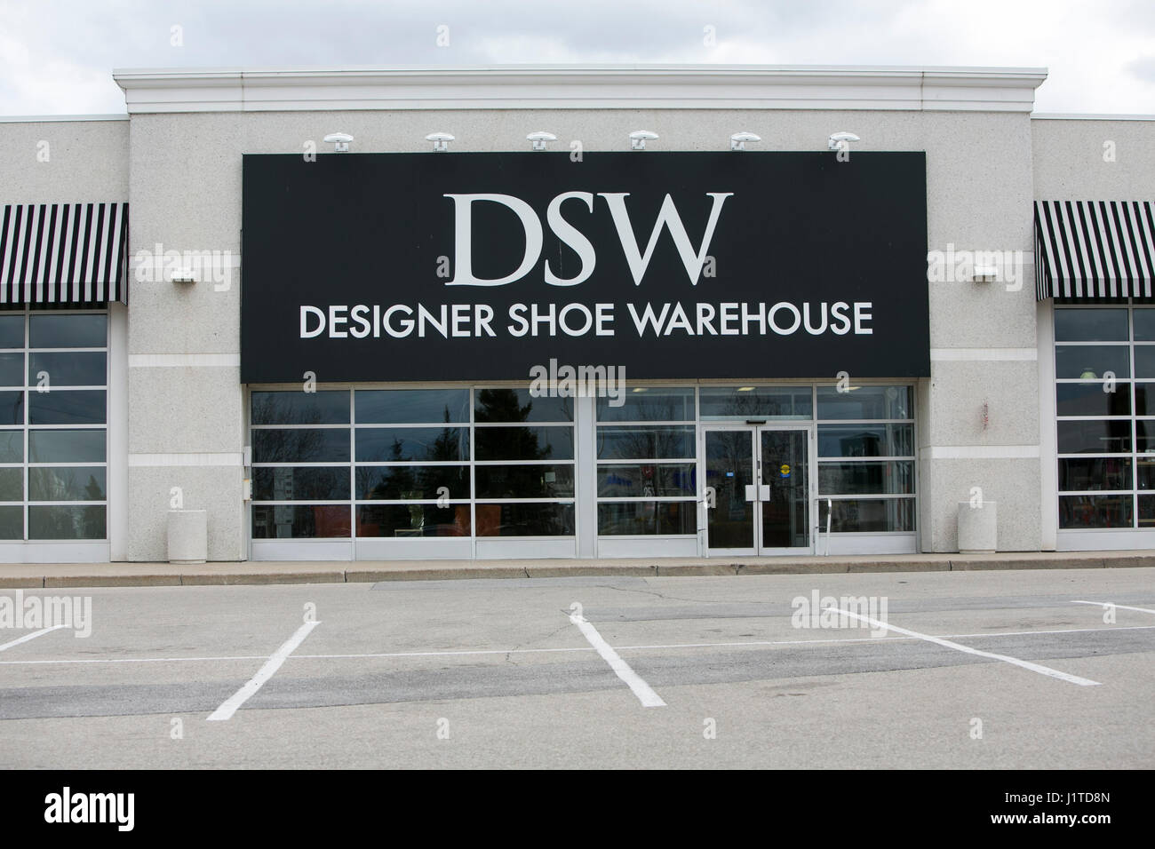 A logo sign outside of a DSW Designer Shoe Warehouse retail store in Mississauga, Ontario, Canada, on April 16, 2017. Stock Photo