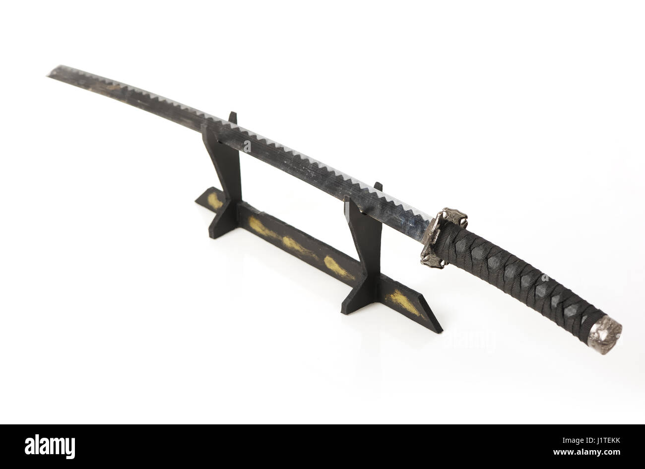 Samurai sword on a stand isolated Stock Photo - Alamy