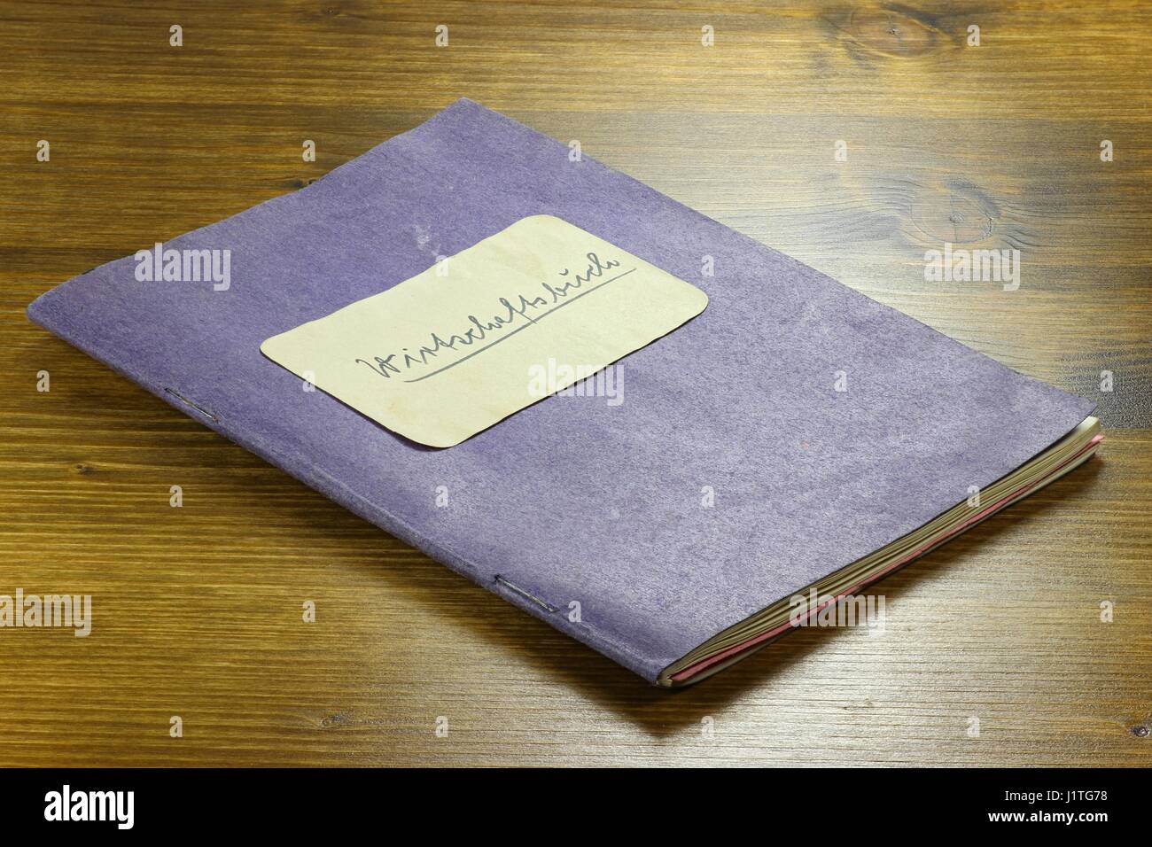 old German housekeeping book on wooden background Stock Photo