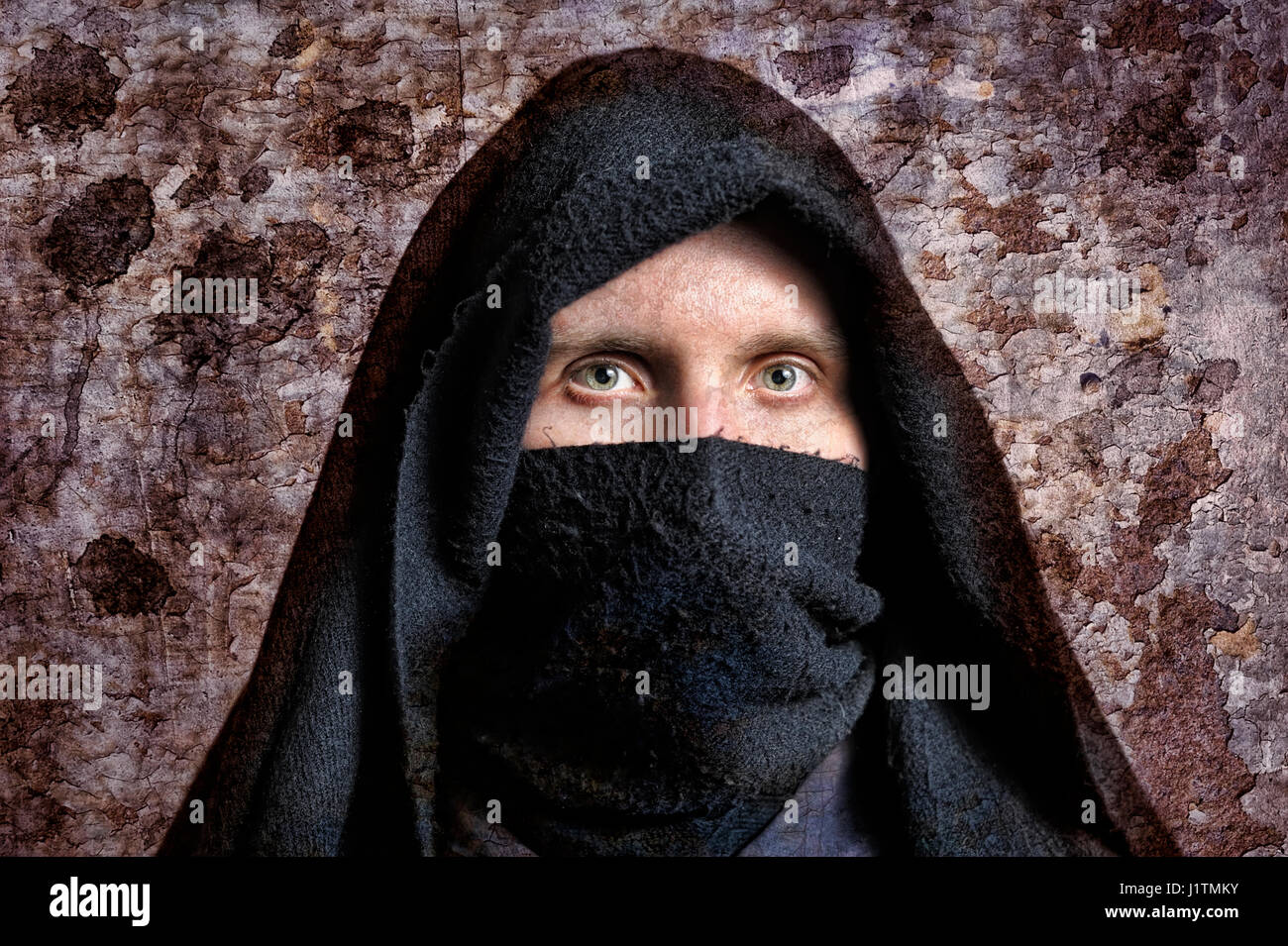 Man in black cloak with hood hi-res stock photography and images - Alamy