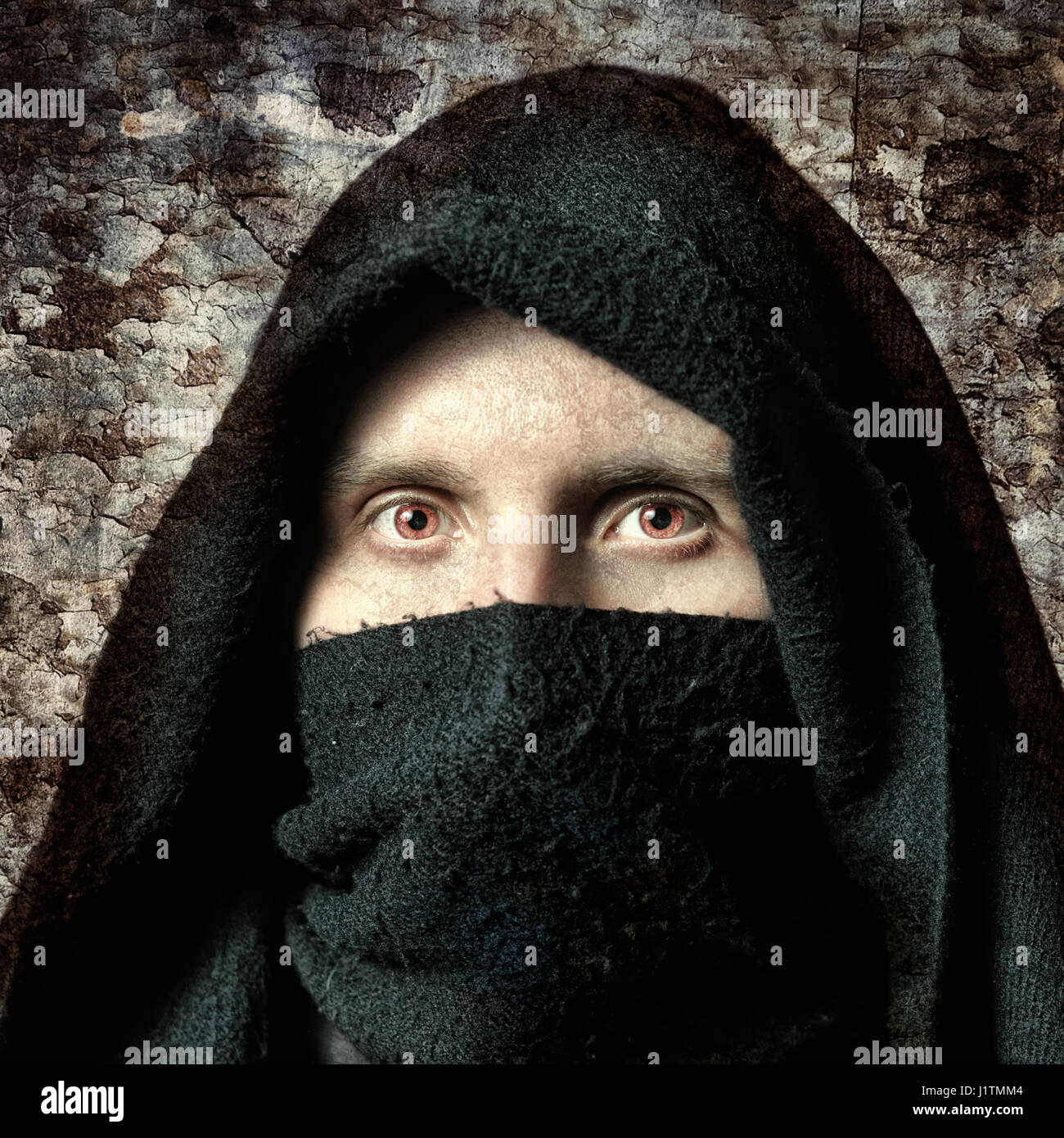 Man in black cloak with hood hi-res stock photography and images - Alamy