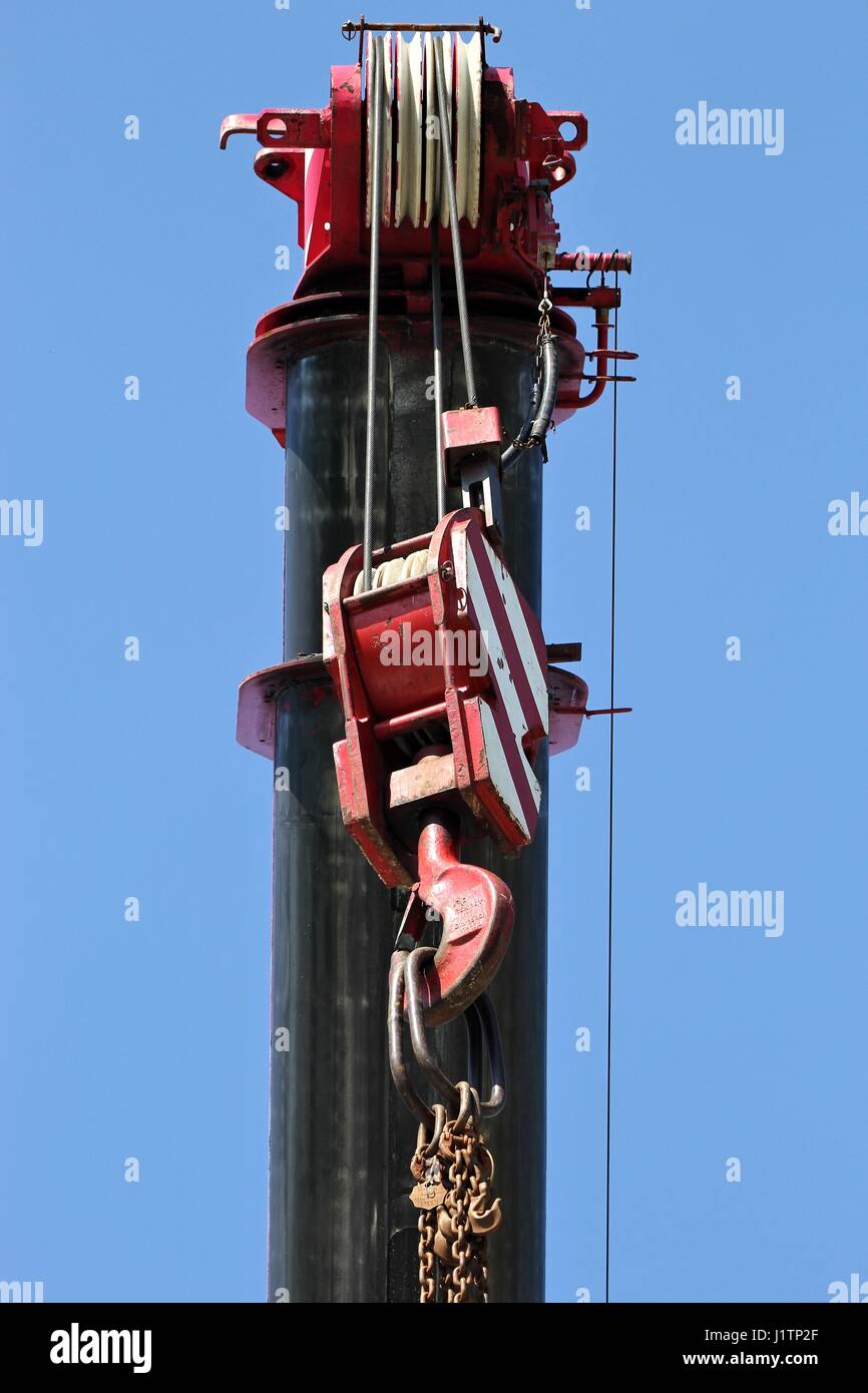 lifting hook against blue sky Stock Photo