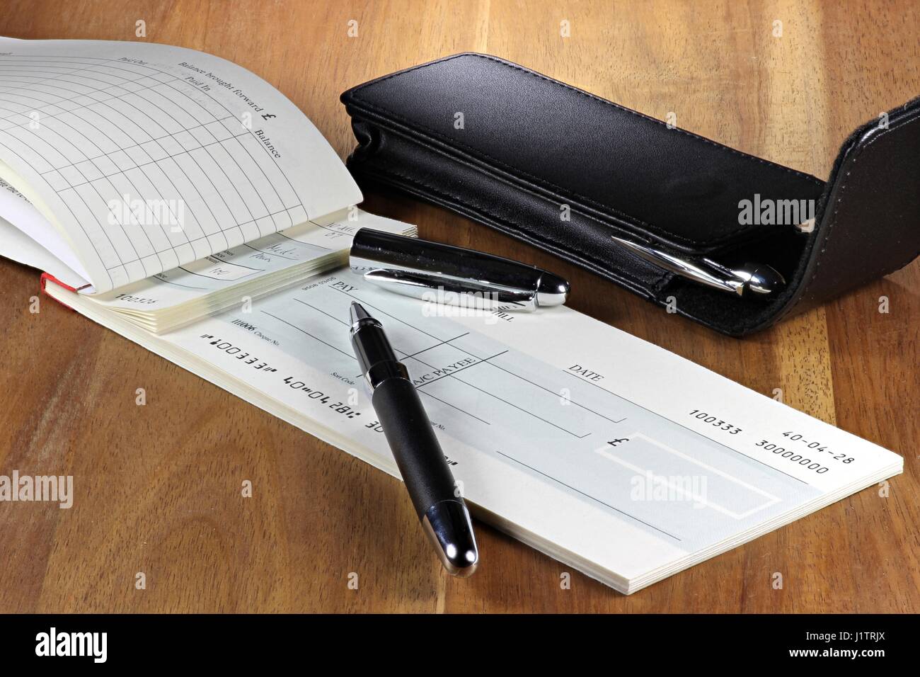 British checkbook on wooden desktop Stock Photo Alamy