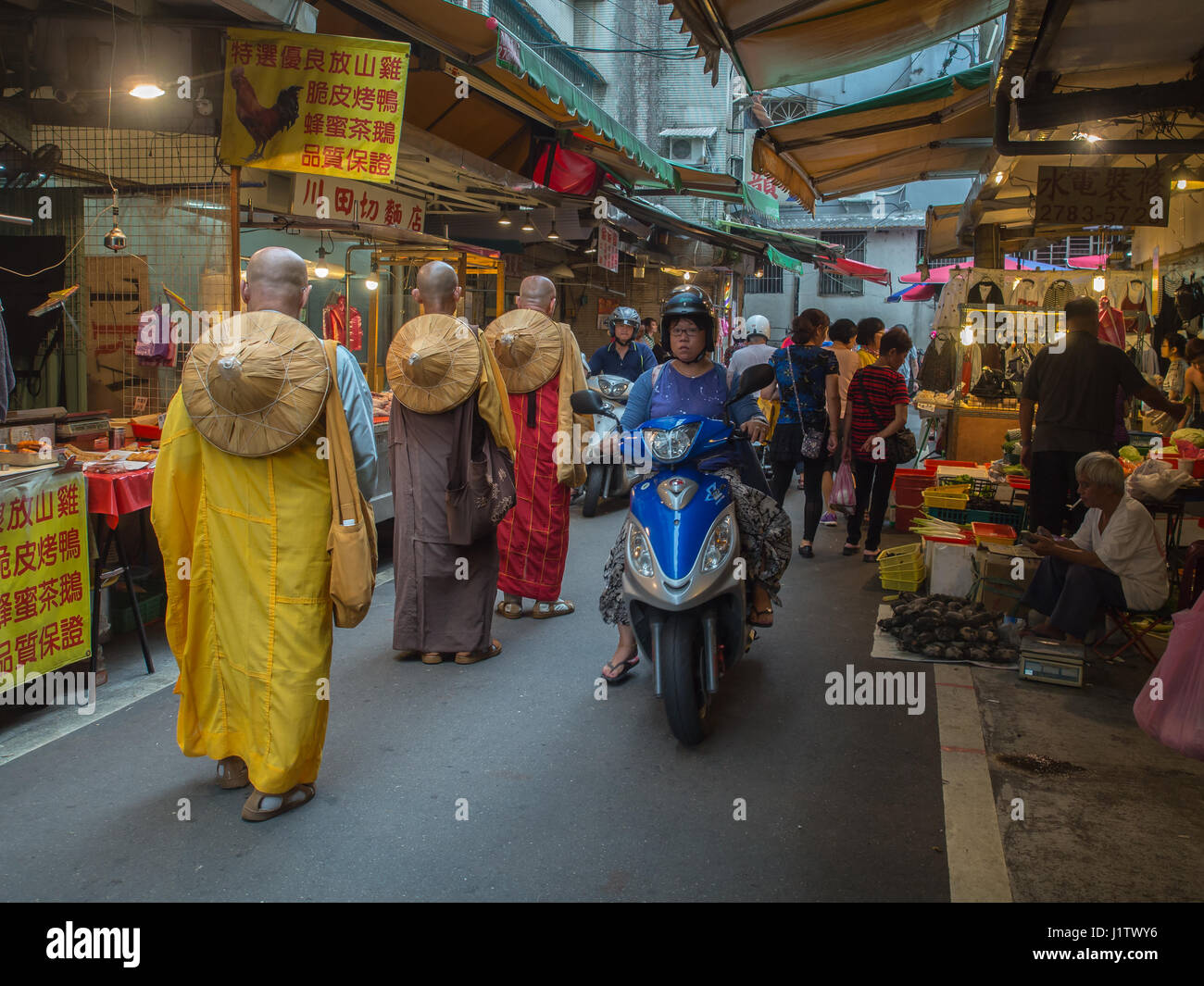 New Taipei City,Taiwan - October 04, 2016: Buddhist monks praying and collecting  donations on  a local market Stock Photo