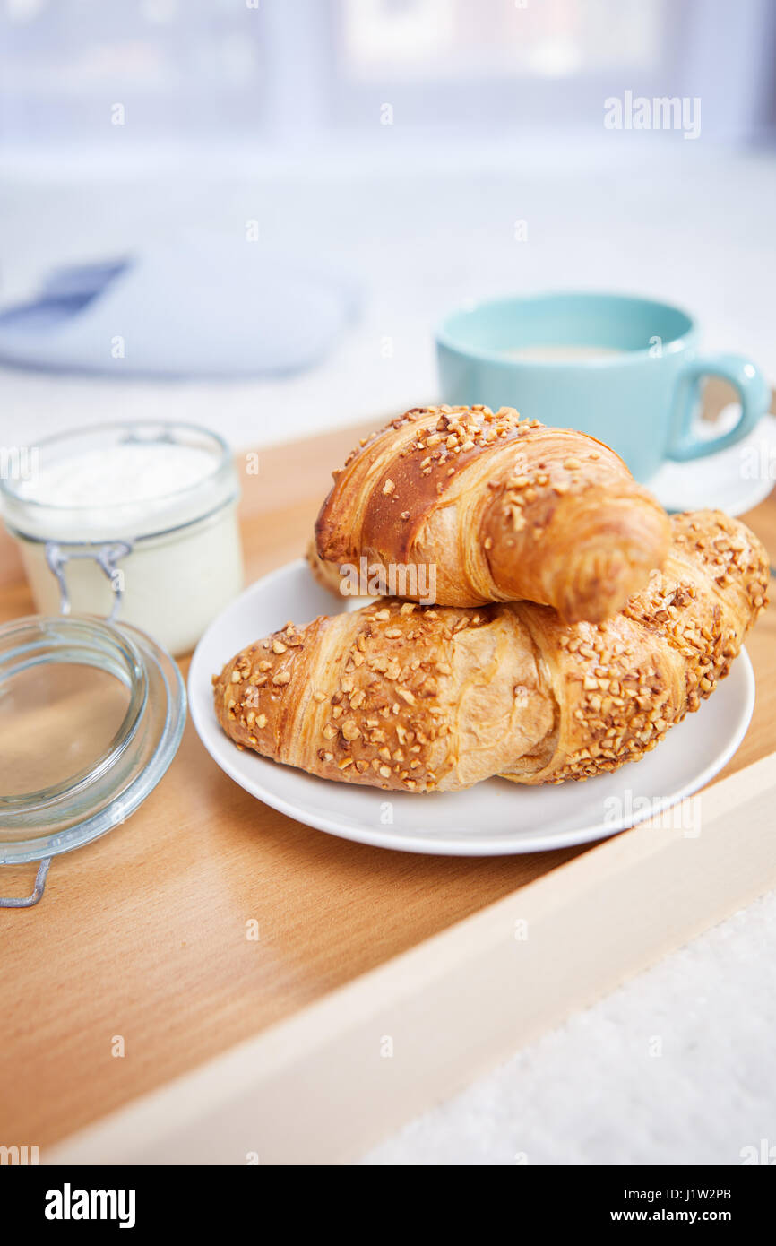 breakfast in bed with coffee and croissants Stock Photo