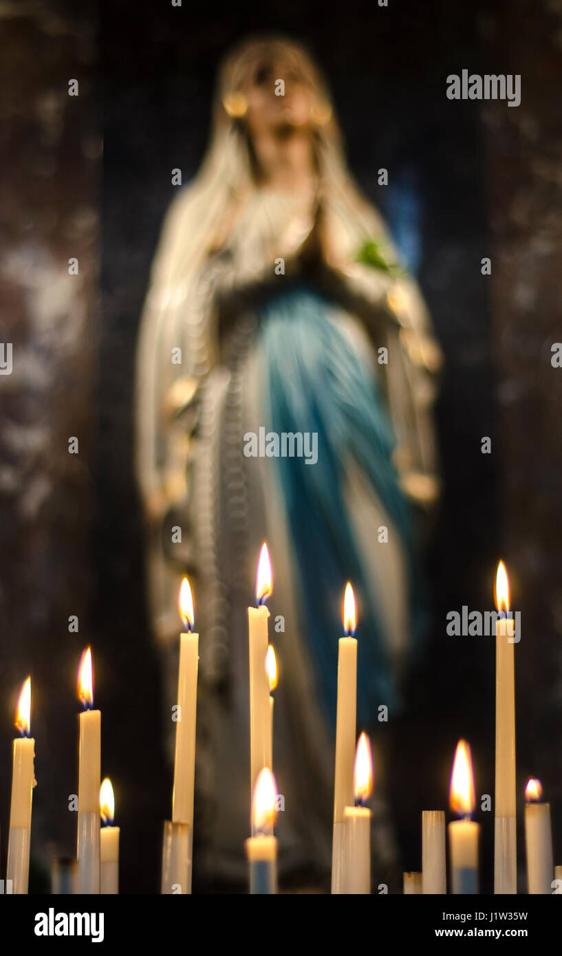 Burning church candles near the altar, Stock Photo