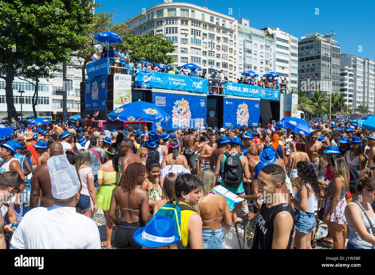 RIO DE JANEIRO - FEBRUARY 19, 2017: Crowds of young people gather in Copacabana to celebrate a morning street party during Carnival. Stock Photo
