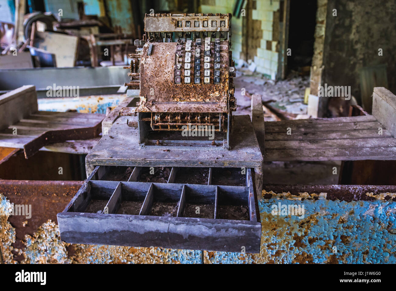 Old rusty cash register in High school No 2 in Pripyat ghost city of Chernobyl Nuclear Power Plant Zone of Alienation in Ukraine Stock Photo