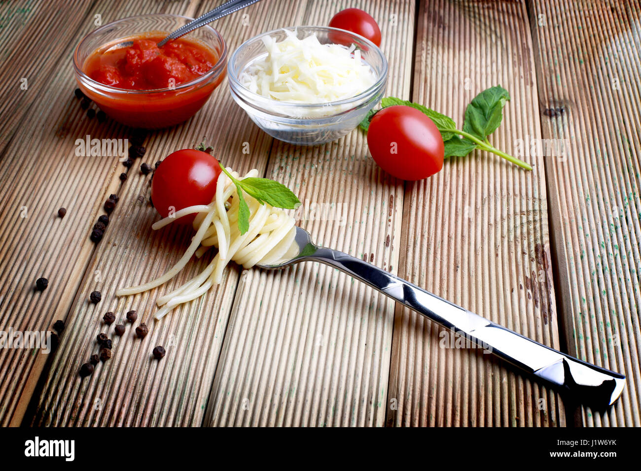 spaghetti on a fork wrapped wooden floors Stock Photo Alamy
