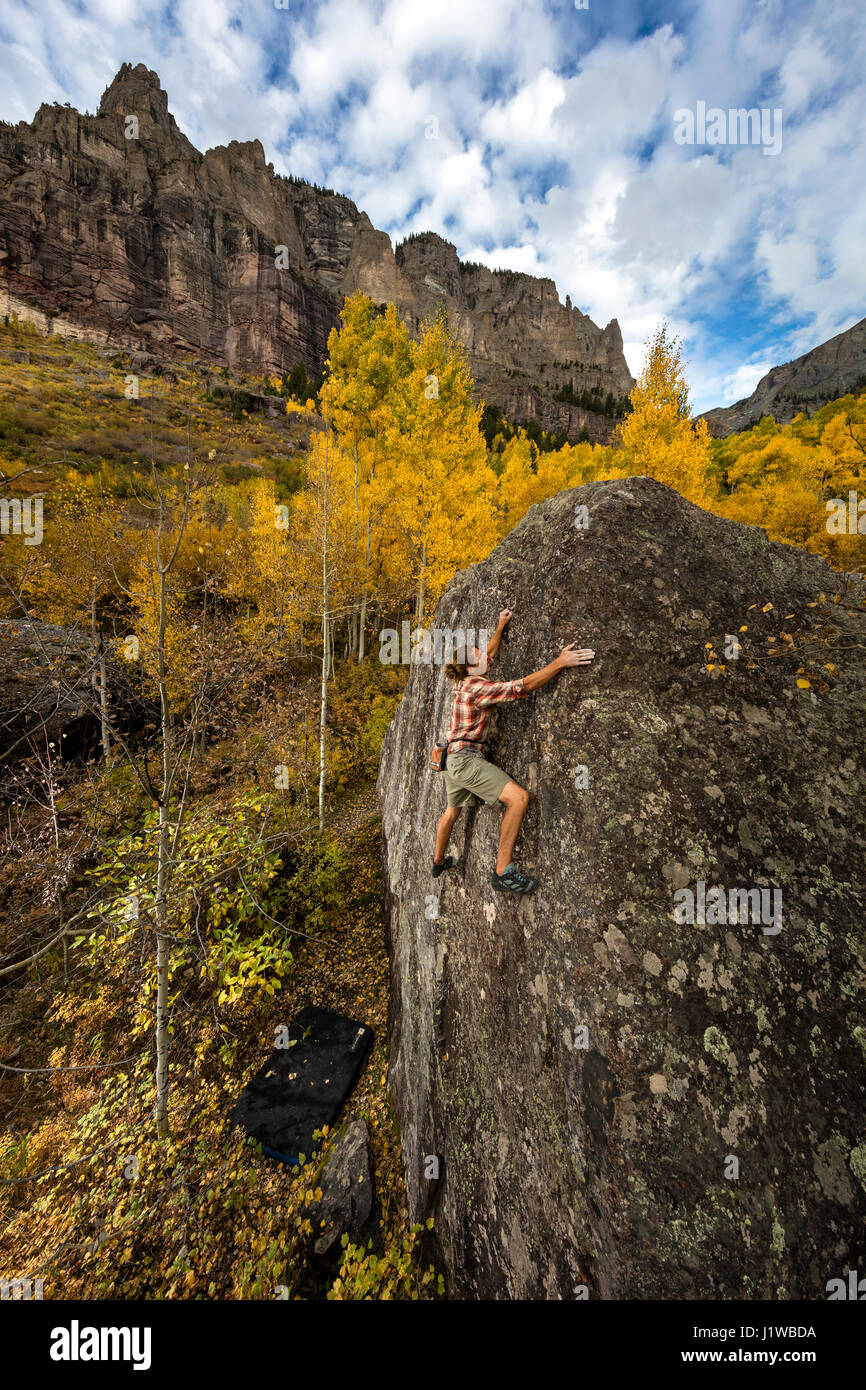 Andrew Merrill bouldering at the Mine boulders near Telluride, CO. Stock Photo