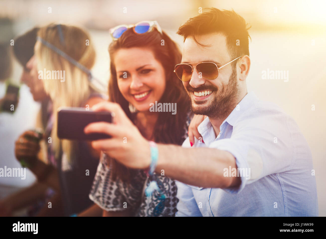 Group of friends having fun outdoors and are happy Stock Photo - Alamy
