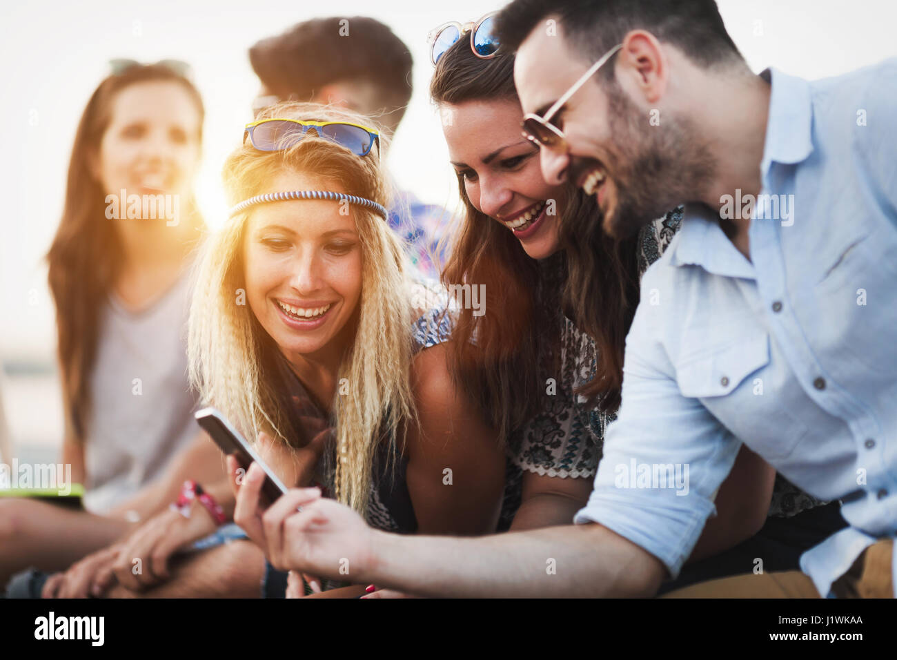 Group of friends having fun outdoors and are happy Stock Photo - Alamy