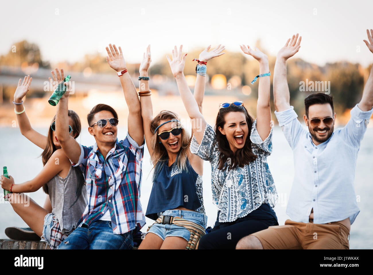 Group of friends having fun outdoors and are happy Stock Photo - Alamy