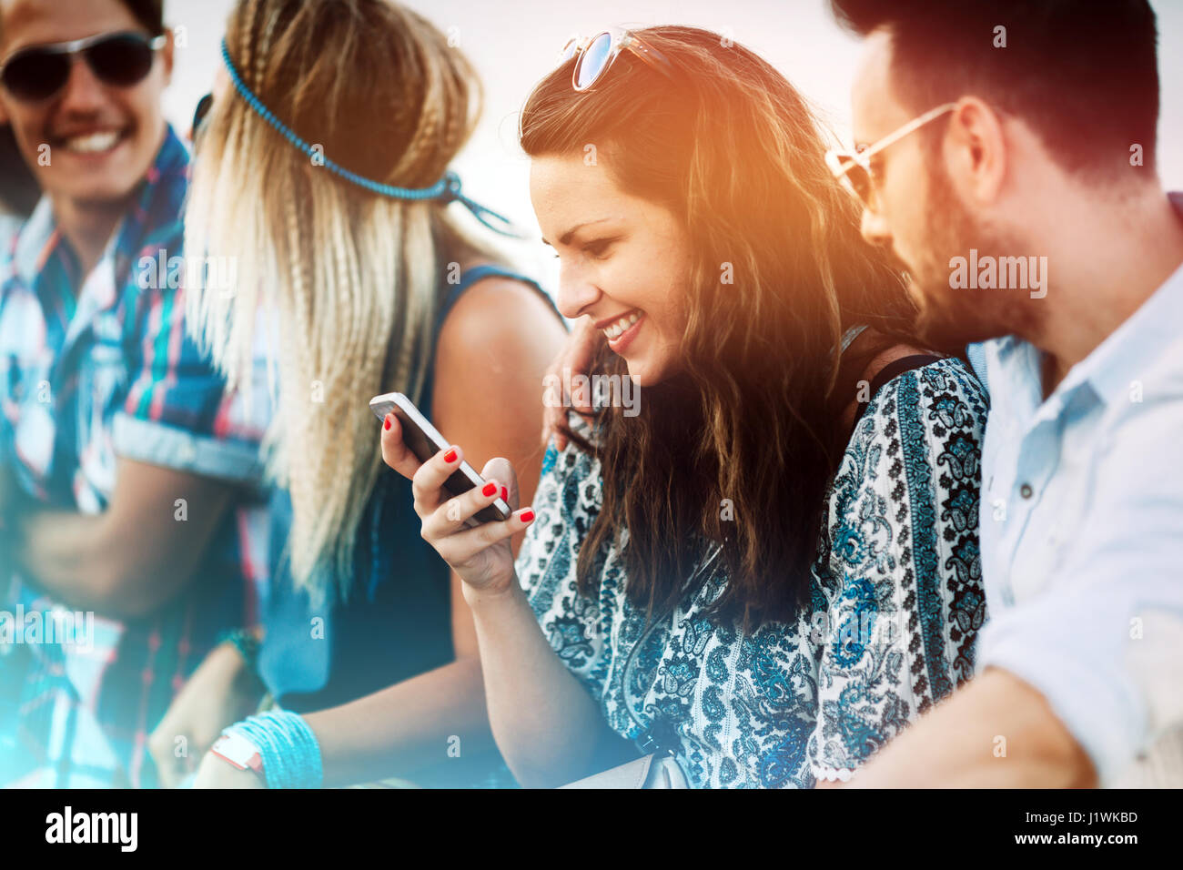 Group of friends having fun outdoors and are happy Stock Photo - Alamy