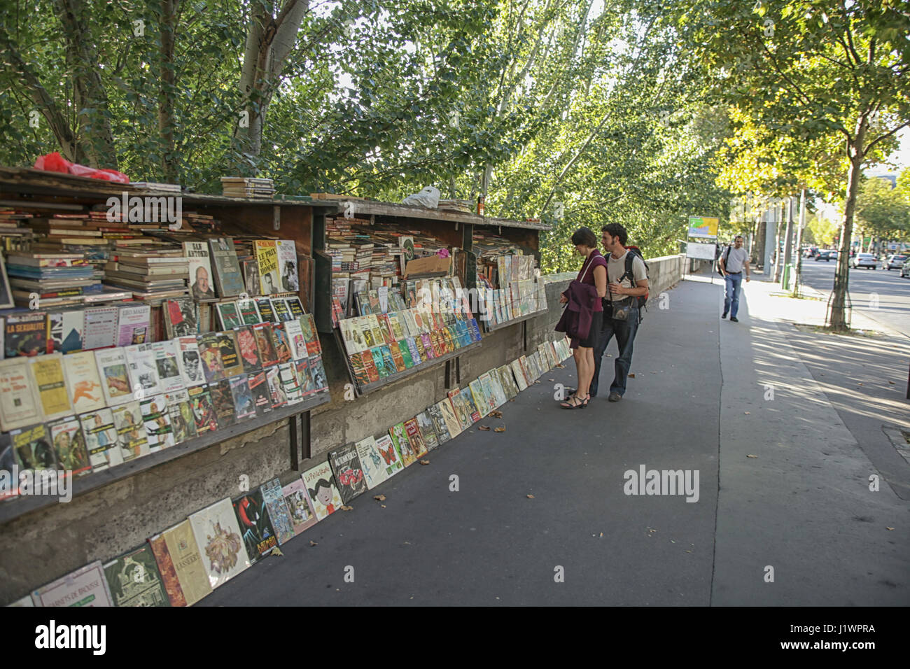PARIS, FRANCE - september 19th, 2010: Second-hand book market on quay of river Seine near cathedral Notre Dame de Paris. Stock Photo
