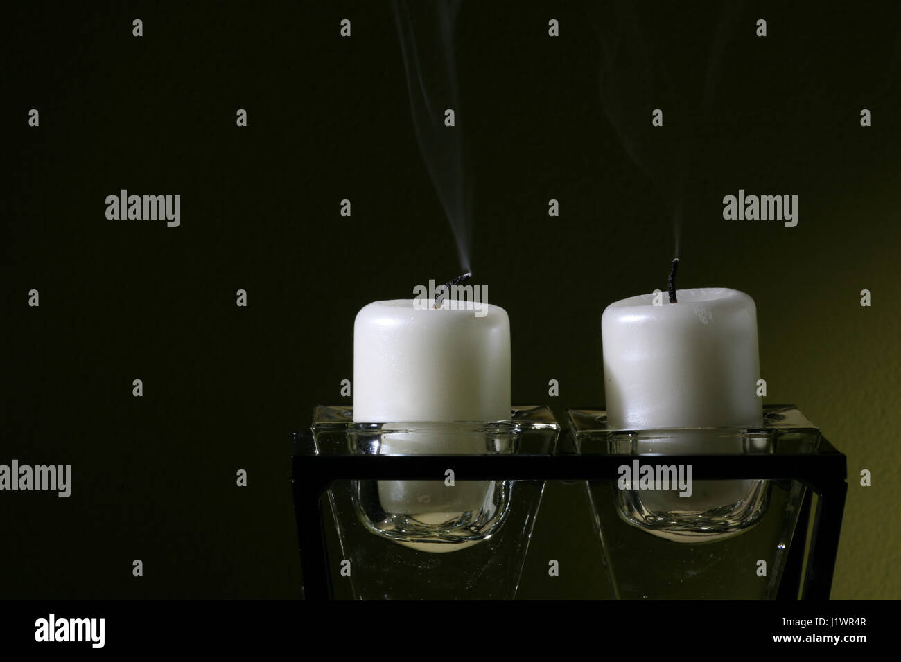 blow out candles in glass candlestick Stock Photo Alamy