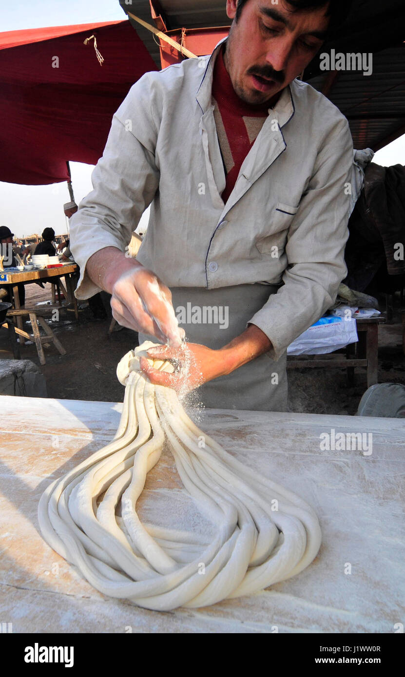 Hand pulled noodles preparation. Stock Photo