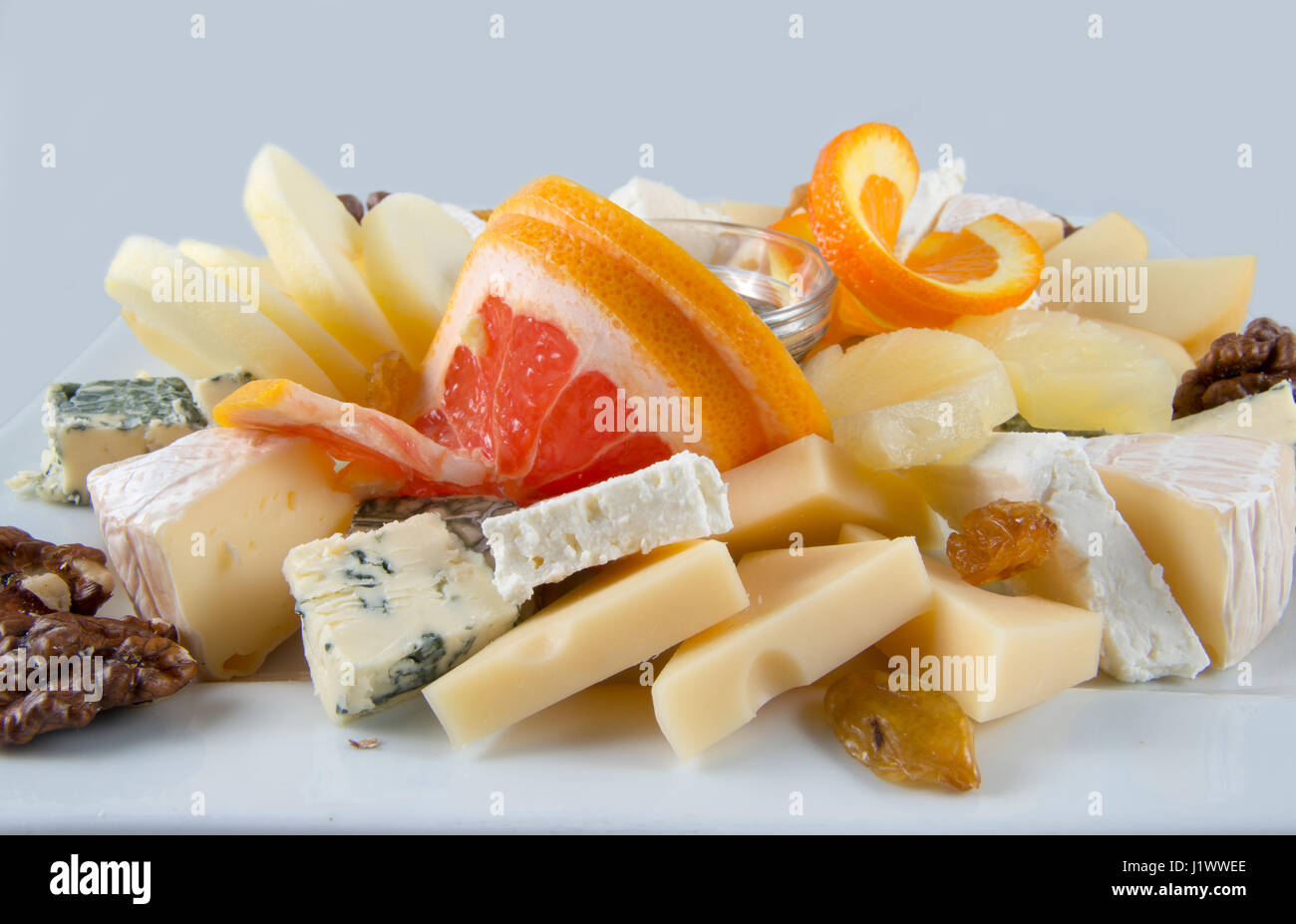Fruit salad with nuts, raisins and cheese Stock Photo Alamy