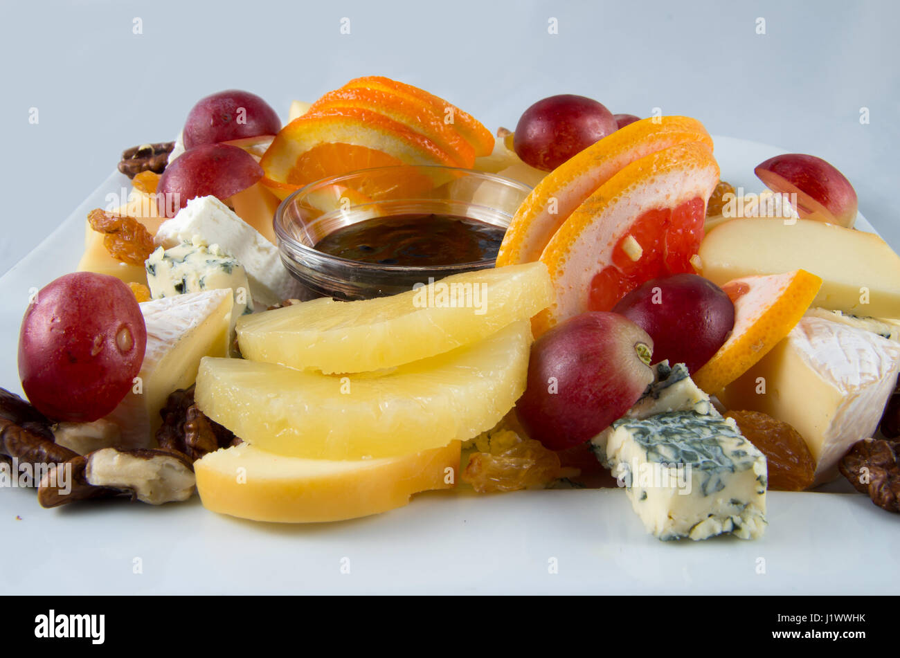 Fruit salad with nuts, raisins and cheese Stock Photo Alamy