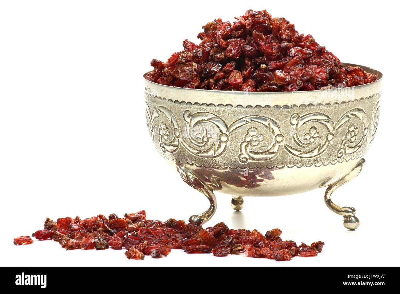 dried berberis in a silver bowl isolated on white background Stock Photo