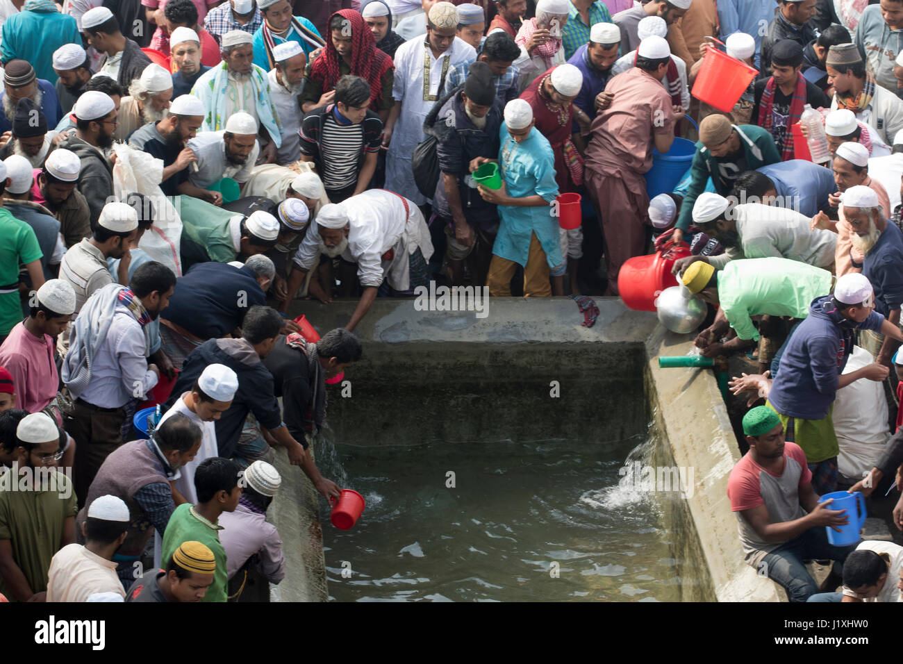 Devotees wash themselves before offering Jumma prayers on the first day of Bishwa Ijtema, the second largest religious congregation of Muslims in the  Stock Photo
