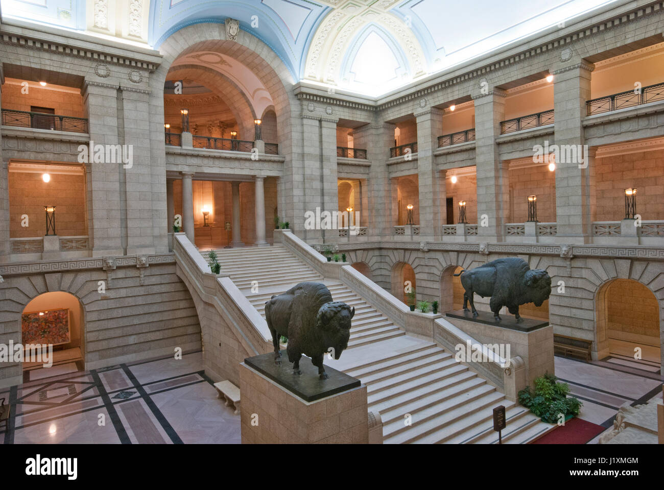 Interior of the Legislative Building with staircase and bronze sculptures of american bison (Bison bison), Winnipeg, Manitoba, Canada Stock Photo