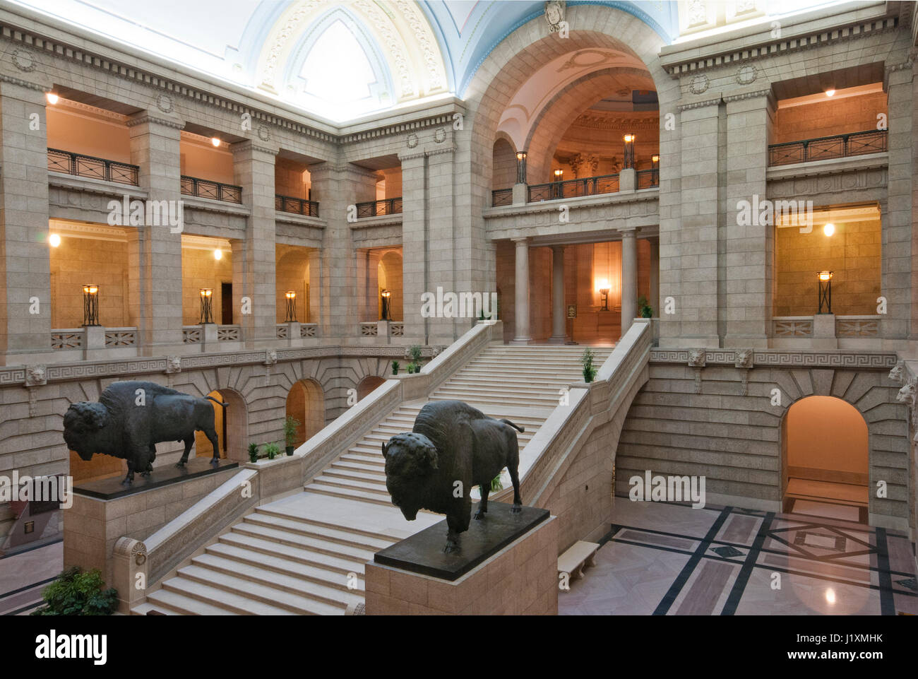 Interior of the Legislative Building with staircase and bronze sculptures of american bison by Georges Gardet, Winnipeg, Manitoba, Canada Stock Photo