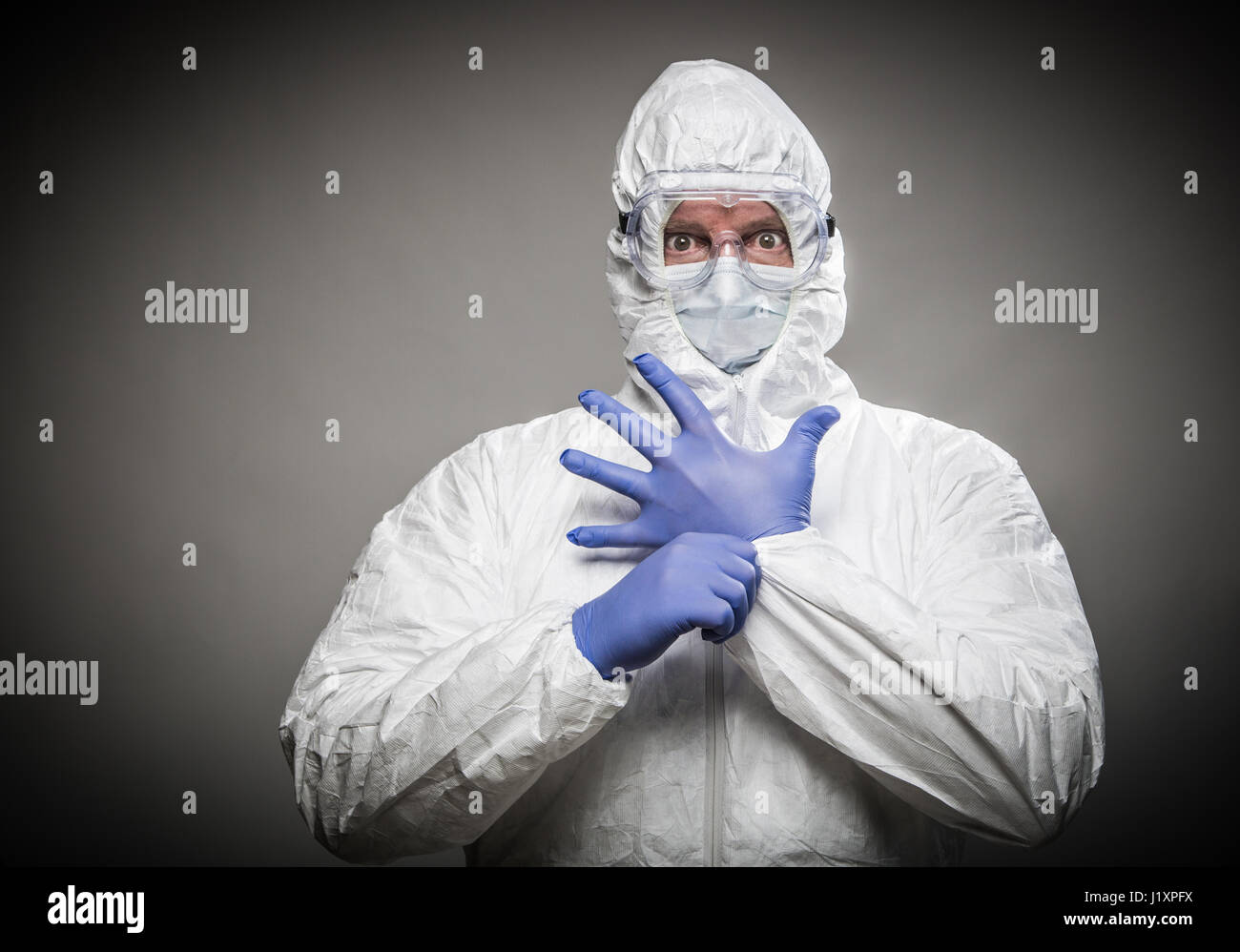 Man With Intense Expression Wearing HAZMAT Protective Clothing Against ...