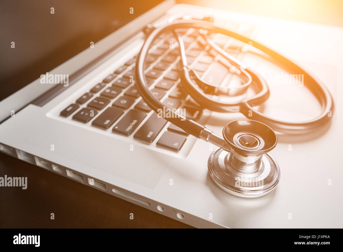 Medical Stethoscope Resting on Laptop Computer Keyboard Stock Photo - Alamy