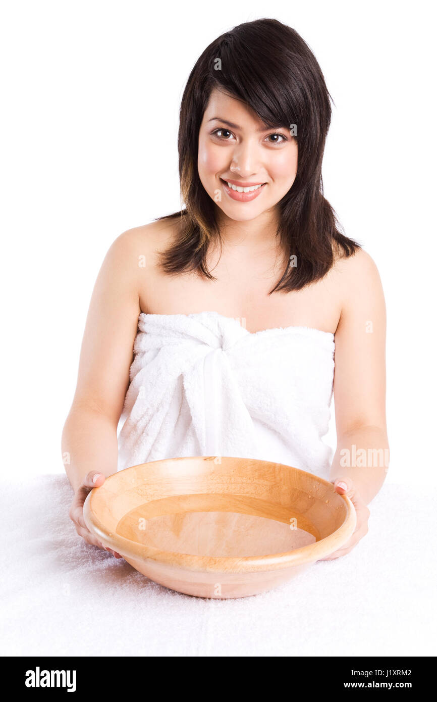 A beautiful asian girl getting ready to wash her face at a spa Stock