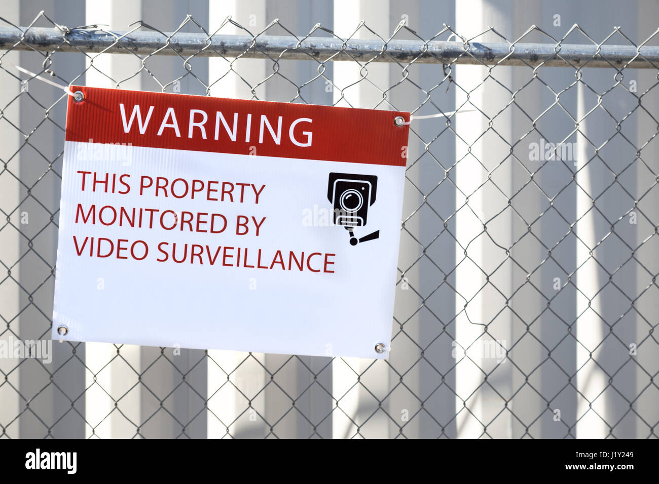 Video surveillance sign outside of a construction site Stock Photo - Alamy