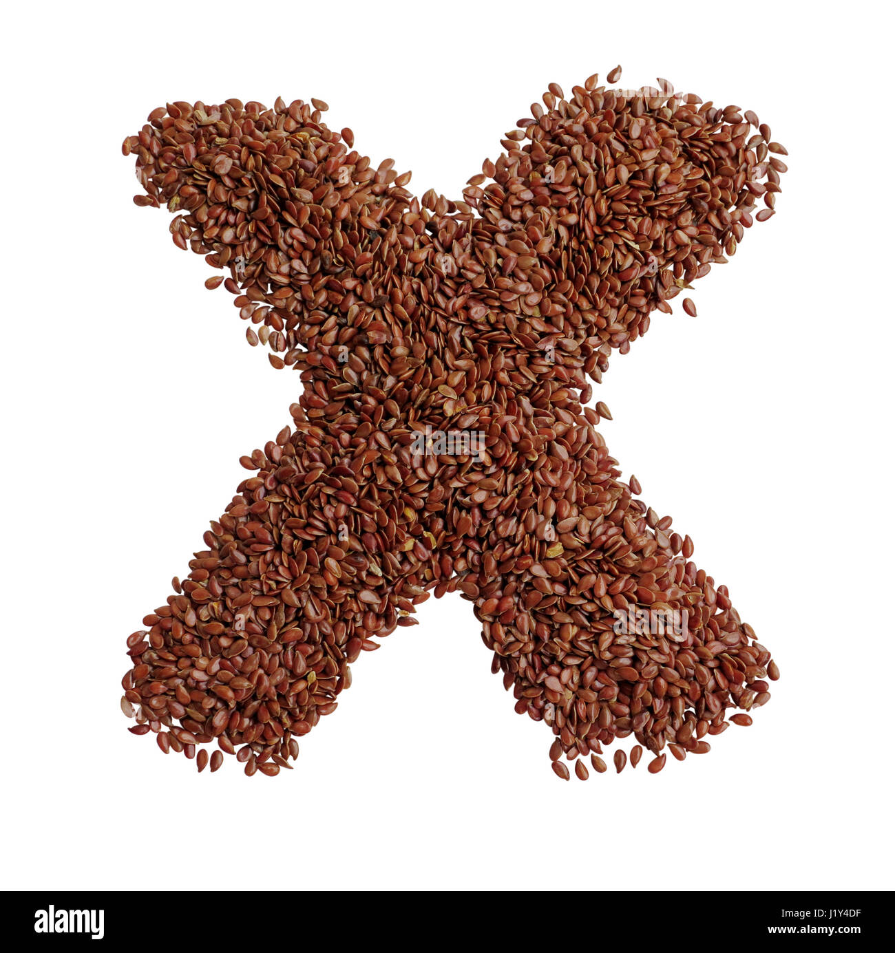 Letter X made with Linseed also known as flaxseed isolated on white ...