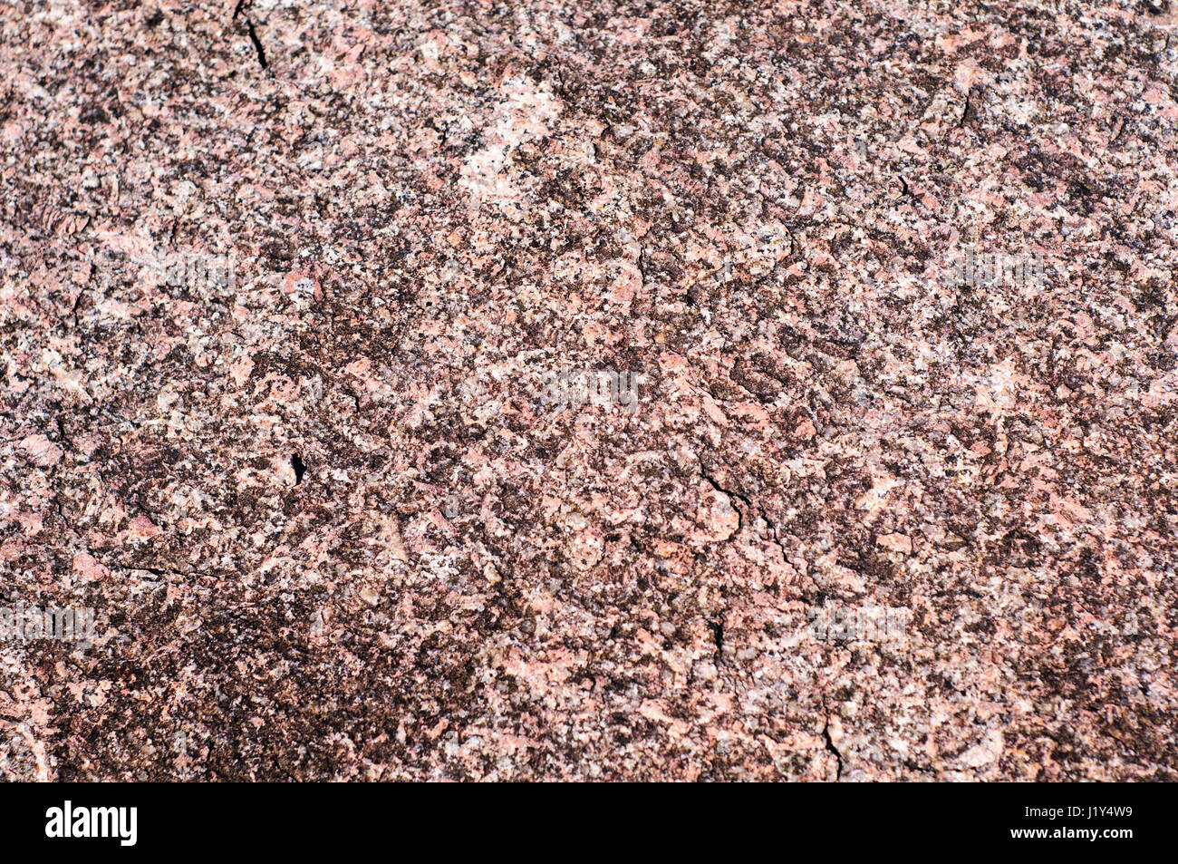 Red granite background texture. Taken near Enchanted Rock on the Edwards Plateau in the Texas Hill Country Stock Photo
