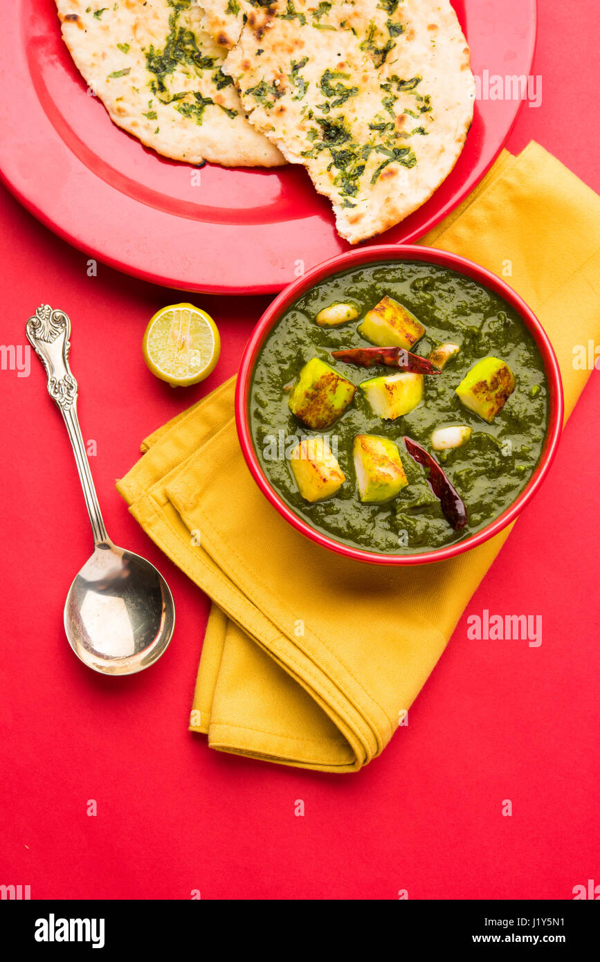 Indian curry dish Palak paneer made up of spinach and cottage cheese, served in white bowl Indian curry dish Palak paneer made up of spinach and cottage cheese, served in white bowl