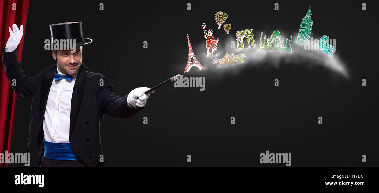 Magician using wand with glowing landmarks from different cities- travel around the world Stock Photo