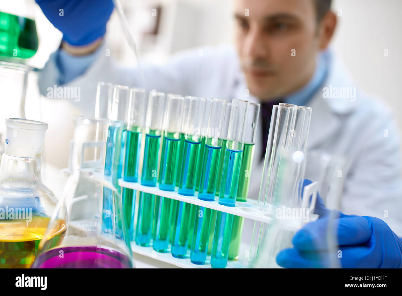glass test tubes filled with liquid for an experiment in a science ...
