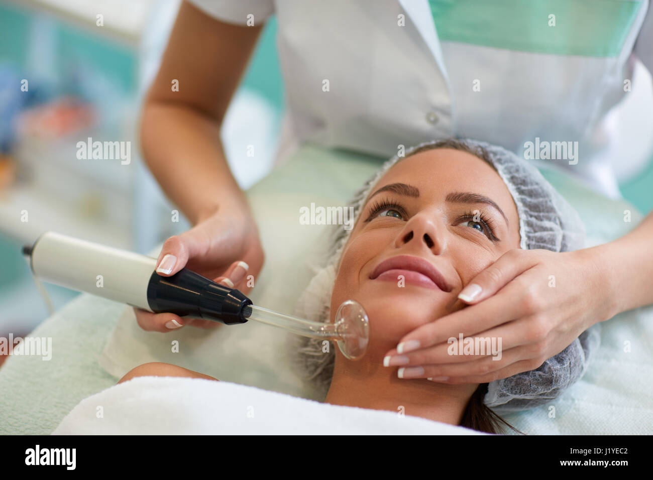 Beauty treatment of face, high frequency infrared spot remover Stock