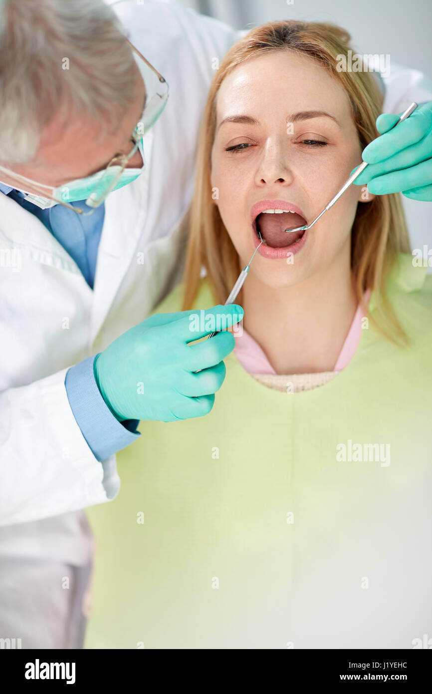 Young female patient on review at dentist in dental practice Stock Photo Alamy