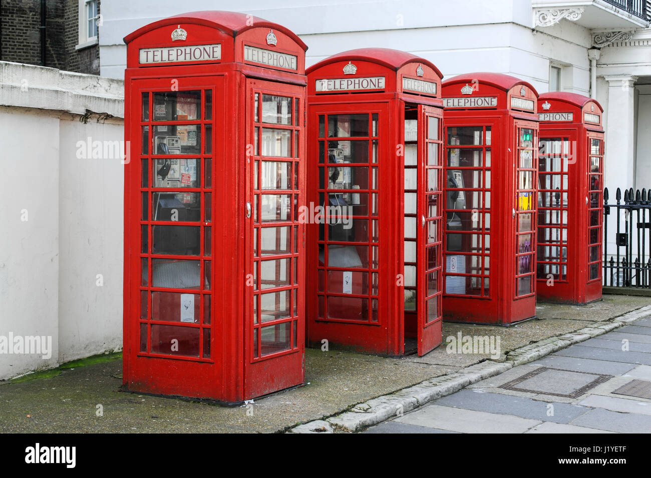 Four public red telephone boxes, or kiosks, in London Stock Photo Alamy