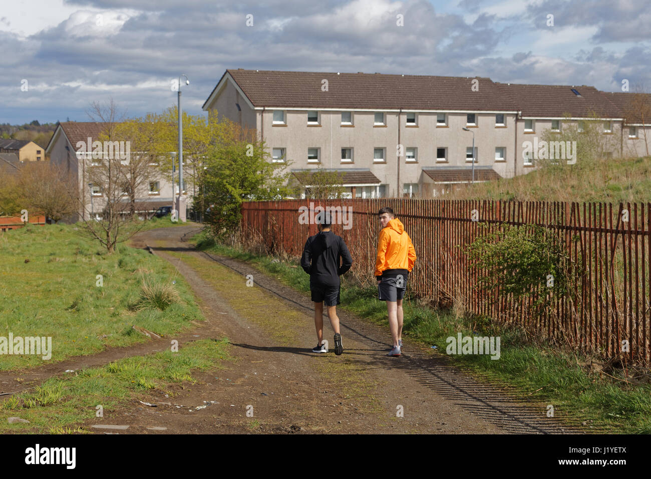 Drumchapel peripheral housing estate Glasgow Scotland sunny everyday scene with local teenage boys Stock Photo