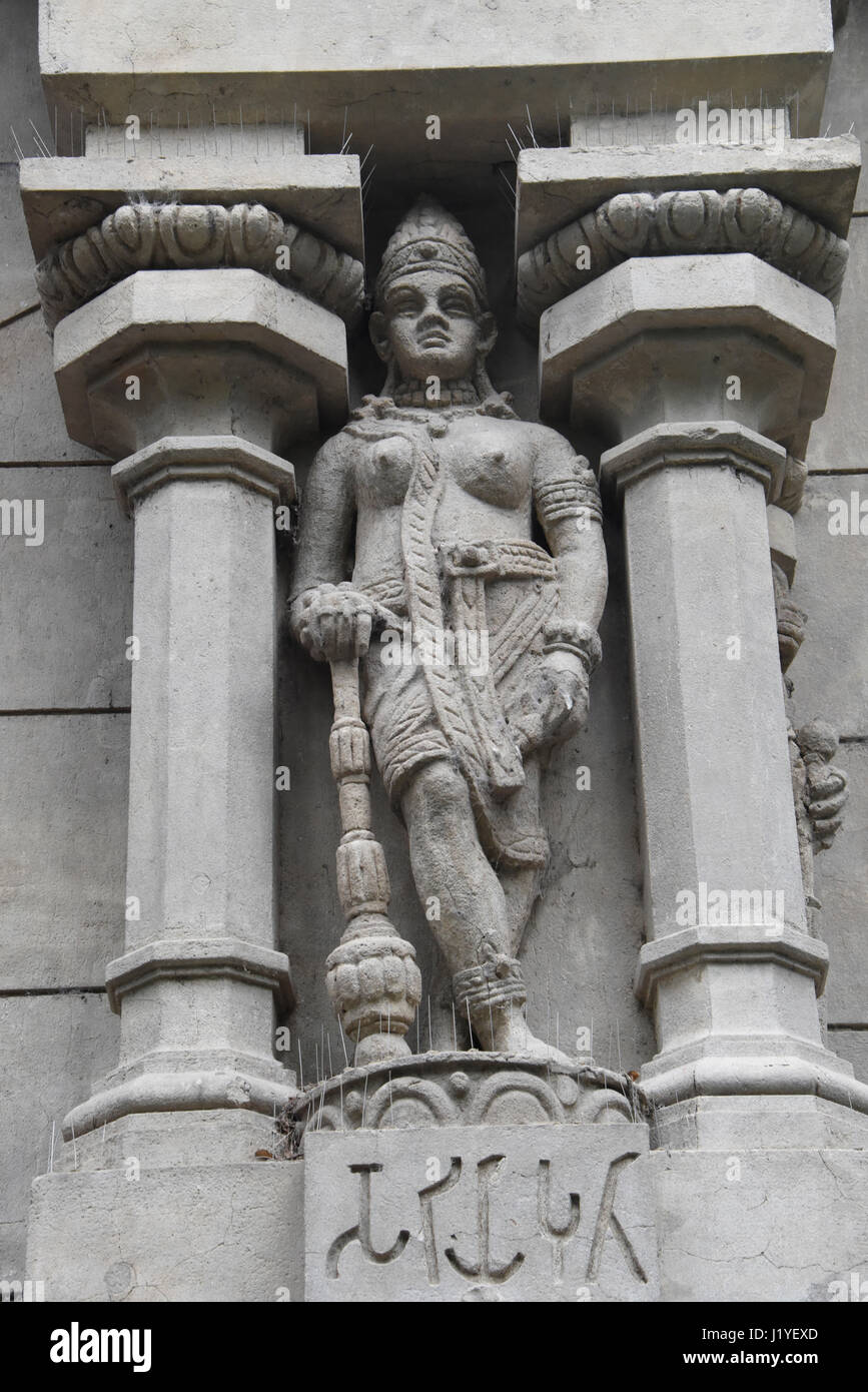 Concrete decorations in the form of a Hindu-style deity standing between two pillars above the Elephant House in Buenos Aires Zoo Stock Photo