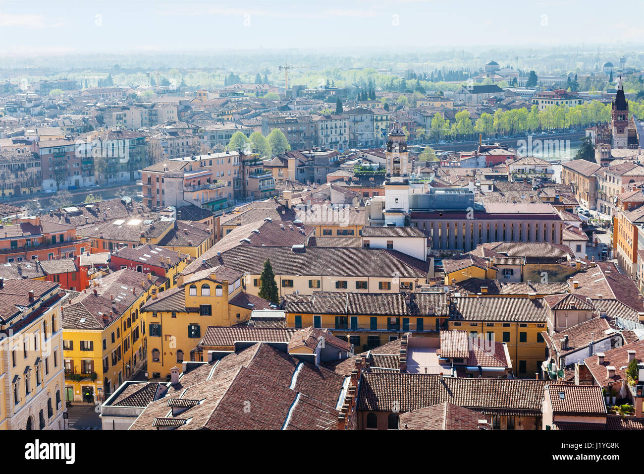 travel to Italy - above view of Verona town with Adige River from tower Torre dei Lamberti in spring Stock Photo